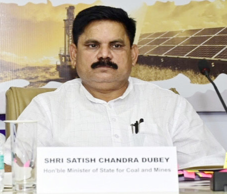Satish Chandra Dubey seated at a conference table behind a nameplate reading Shri Satish Chandra Dubey, Hon'ble Minister of State for Coal and Mines