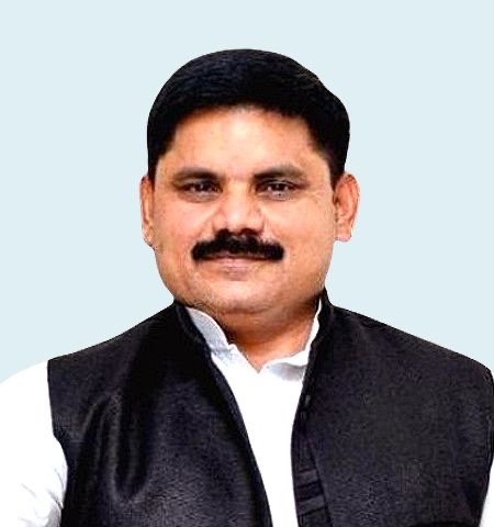 Portrait of Satish Chandra Dubey in a white kurta and dark waistcoat